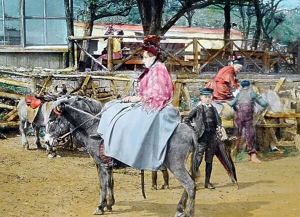 Donkey rides at a village fete, Victorian period