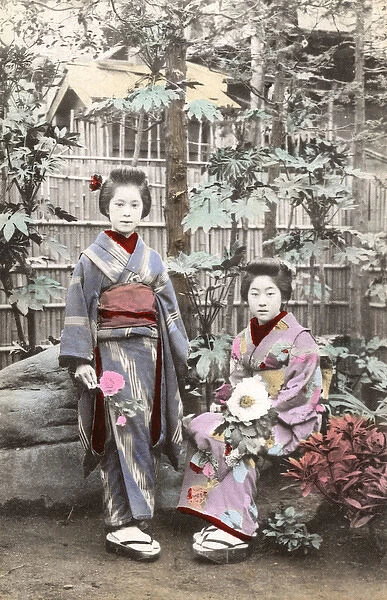 Two Japanese Geisha Girls wearing Kimonos