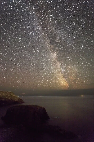 An autumn view of the Milky Way over the Atlantic Ocean, seen from the cliffs of Land's End, the most southwesterly point of Great Britain, Cornwall, England, United Kingdom, Europe