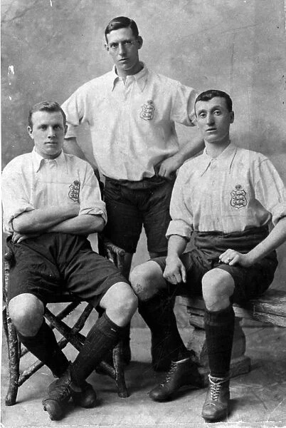Three footballers in England shirts. The player on the right is Albert Sturgess who also played for Sheffield United, c. 1912