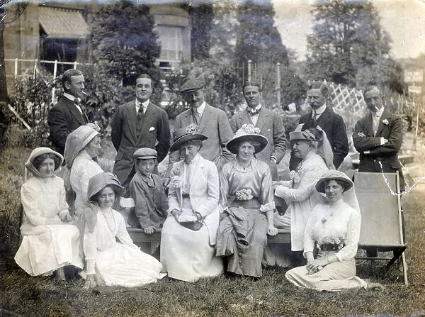 Wightman family and friends group of 14 individuals in unknown garden setting, c. 1910