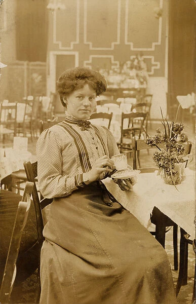 Woman drinking in the cafe at the Olympia Skating Rink, Sheffield, c. 1911