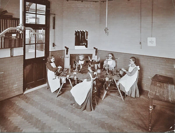Girls knitting socks by machine at the Elm Lodge School for Blind Girls, London, 1908