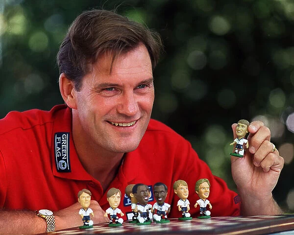 England Manager, Glenn Hoddle playing with miniature figures of the England squad 1997
