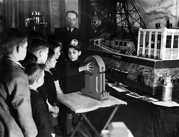 Leonard Hector aged 9, demonstrating his fathers invention to this schoolmates in