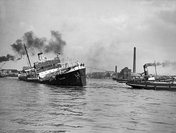 Norwegian Timber Ship being towed up the Thames by a Dutch Tug boat after a gale in