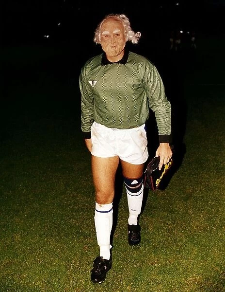 Peterborough goalkeeper Fred Barber walks off the pitch wearing a face mask after a match