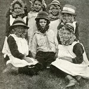 Group of children wearing wild flowers, Somerset, England