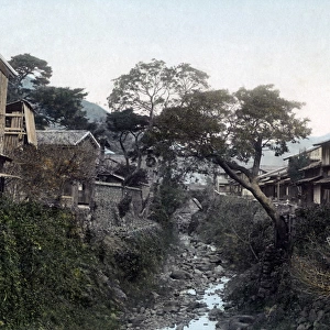 A stream and houses at Nakajima, Nagasaki, Japan, circa 1880