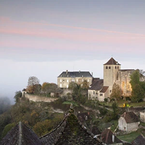 France, Midi-Pyrenees, Lot, Montvalent village illuminated before sunrise
