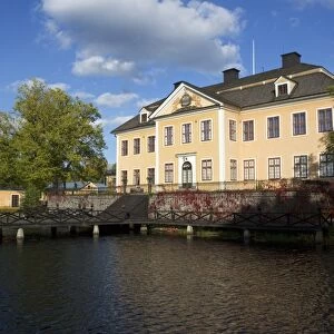 View of manor house beside water, Lovsta Manor, Lovstabruk, Uppsala County, Uppland, Sweden, october