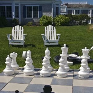 USA, Massachusetts, Chatham. Looking towards chairs and buildings from a giant chess