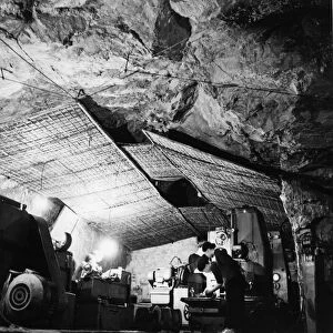 An auto repair shop in a cave near thank hao along the ho chi minh trail, vietnam war, 1968