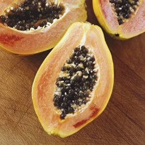 Halved papaya showing the fresh fruit and seeds inside