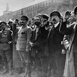 A parade in red square, moscow, soviet union, may 1st, 1922, left to right: mikhail lashevich (second from left), leon trotsky (center, military uniform, beard), lev kamenev (second from right), tomsky (far right)