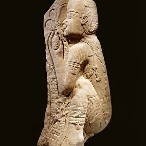 Quartzite relief representing a Nubian prince picking dates from a palm tree, circa 540 b. c