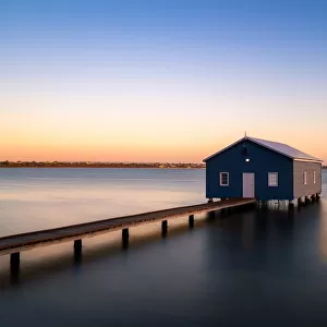 Sunset over blue boathouse in the Swan River in Perth, Western Australia, Australia