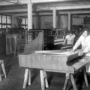 Piano Making at Brinsmeads Factory. Polishing a fine satinwood case. 10 December