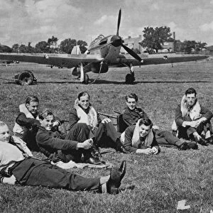 Fighter pilots resting between battles, autumn afternoon, England, 1940 (b / w photo)