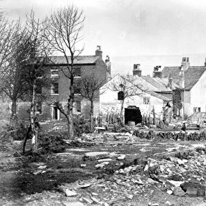Sheffield Flood, Damage at the head of Bacon Island (formed by the River Don dividing into two branches), 1864. House on left, is The Grove, off Low Road, (named as a Boarding School in the book, Photographs of the Sheffield Flood ). Goit, right