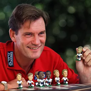 England Manager, Glenn Hoddle playing with miniature figures of the England squad 1997