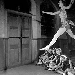 Ballet dancer Maureen Gardner gives instructions to children during one of her classes