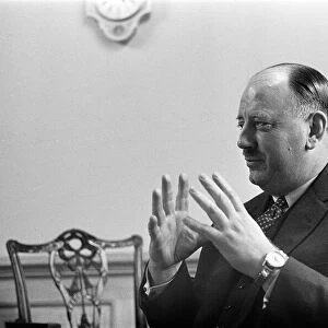 Dr Richard Beeching, Chairman of British Railways, pictured in his office