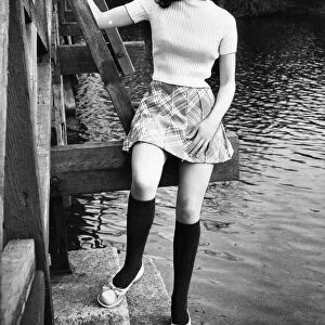 A model poses in socks by Twiggy and a Mary Quant Beret