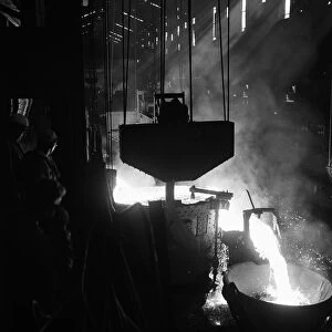 Molten steel is tapped off from one of the open hearth furnaces at the Stocksbridge